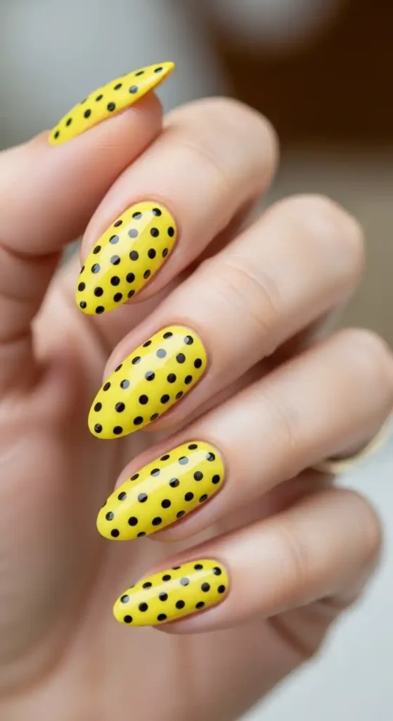 bright-yellow-nails-with-black-polka-dots